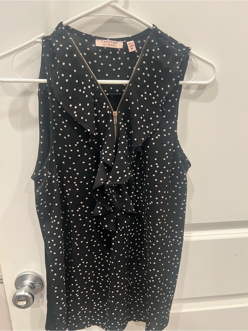 Tempted Black Polka Dot Ruffle Zip Sleeveless Top